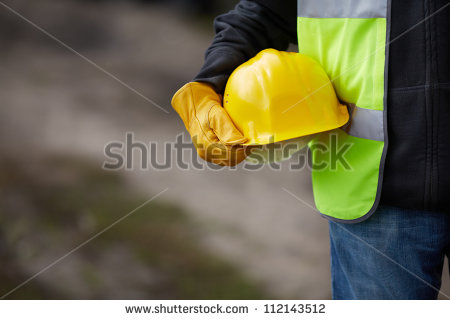 stock-photo-builder-with-yellow-helmet-and-working-gloves-on-building-site-112143512