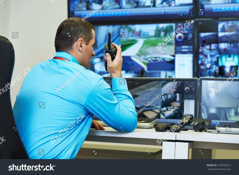 stock-photo-security-guard-watching-video-monitoring-surveillance-security-system-279694013