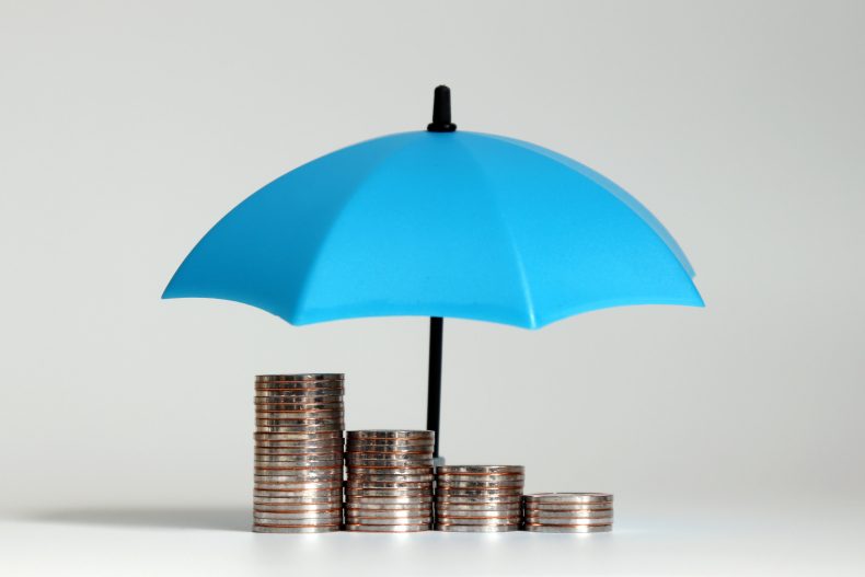 A pile of coins and open blue umbrellas.